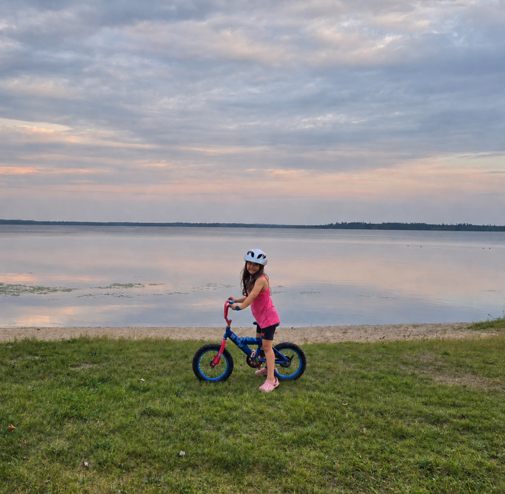 Dylan riding her 16-inch bicycle near Waskesiu after our Saskatchewan bikepacking trip